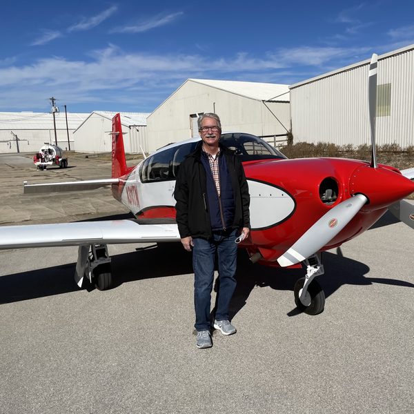 Chuck Taylor with airplane (optional testimonial photo)